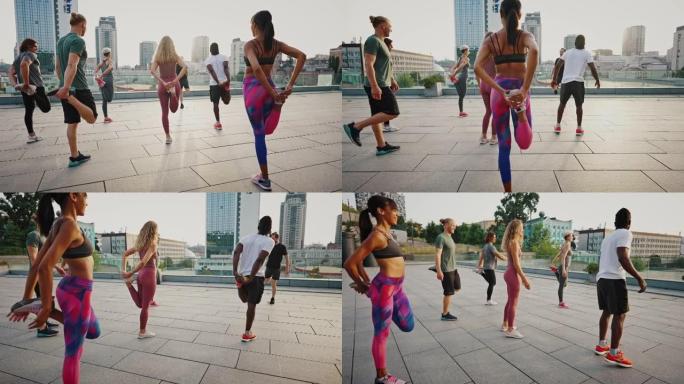 由年轻男女组成的多种族团队，一群志同道合的人在晨跑前在城市景观的背景下进行伸展运动。女孩训练一队运动