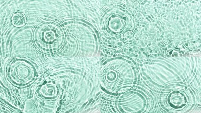 绿色薄荷bg上的水滴随着波浪落下