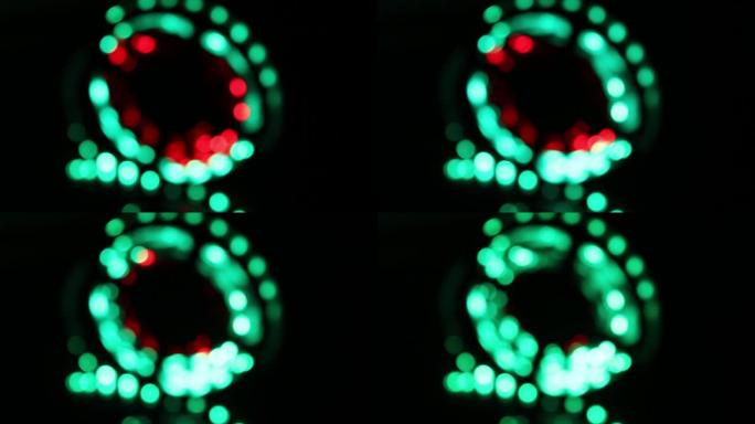 明亮的红色和绿色彩色灯带发光。抽象模糊的bokeh灯