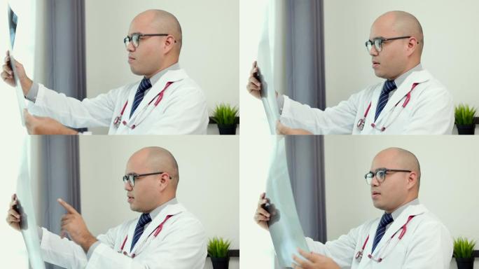 年轻的亚洲医生在家工作，看起来像x光片。通过视频会议在线报告患者的x射线症状和结果。