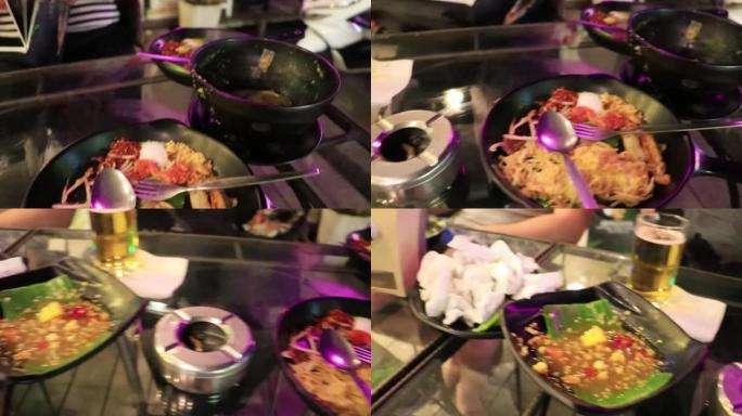 在泰国曼谷餐厅完成典型的泰国辣食物晚餐。