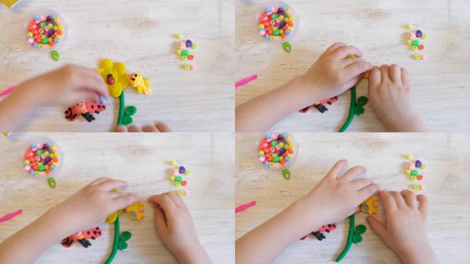 家庭教育游戏用粘土和自然材料，花和女虫从彩色橡皮泥，早期发展理念。带孩子的教育和娱乐课程