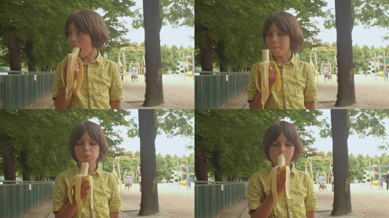 穿着黄色衬衫的男孩正在吃香蕉，刺激内啡肽的产生。