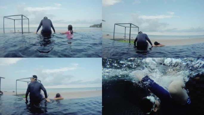 亚洲儿童在度假期间与家人，生活方式概念一起在酒店的游泳池里放松和嬉水。