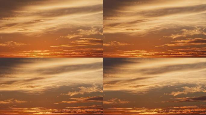 在日落时间用光线关闭云自然背景延时镜头，红色橙色蓝色日落天空云4k镜头。