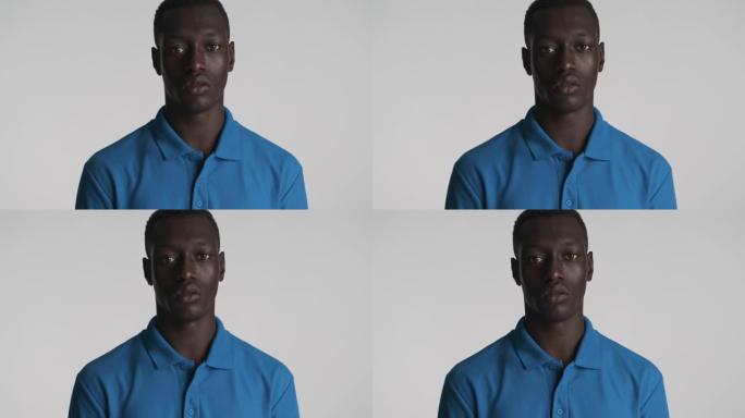 年轻自信的非洲裔美国人专心地看着相机