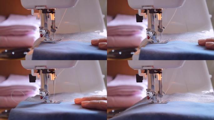 针扎织物的特写镜头，缝纫机的脚降低，缝纫过程。