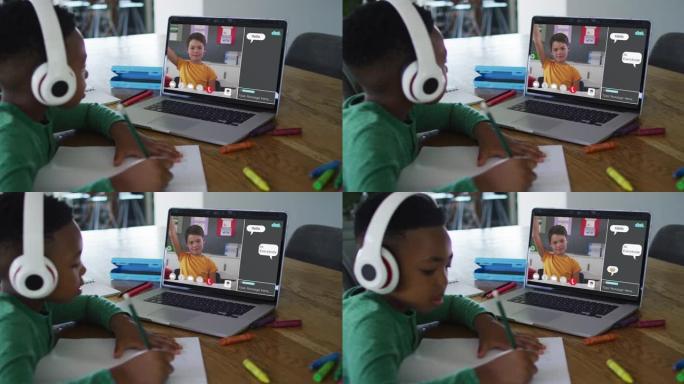 小学生在家中使用笔记本电脑进行在线课程，男孩在屏幕上进行手提和网络聊天