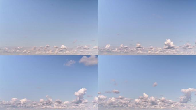 蓝天中的白云正在向前漂浮，复制空间。云彩飘向观众，在镜头前，延时