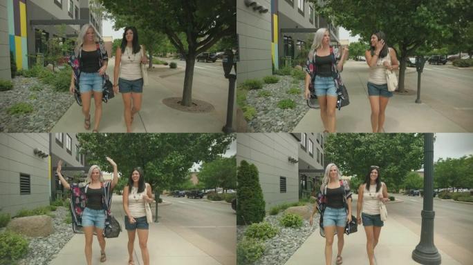 两名千禧一代女性卸车行走在城市街道上旅行4k视频