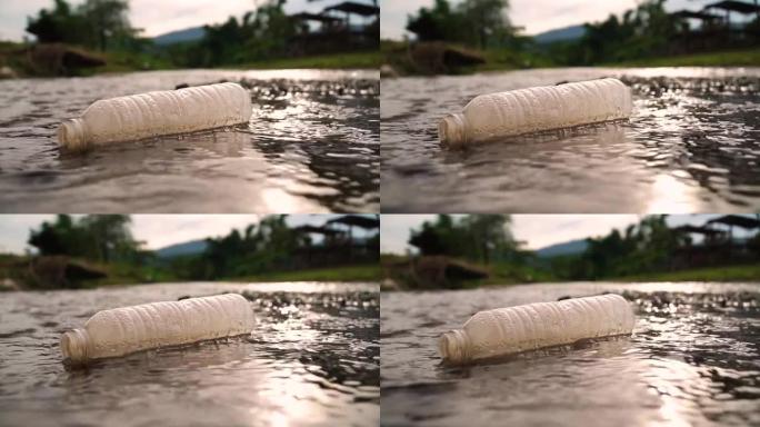自然污染，生态科学概念。漂浮在水中的塑料瓶，俯视图。在溪流湖或河流中丢弃的塑料废物，将塑料瓶扔进溪流