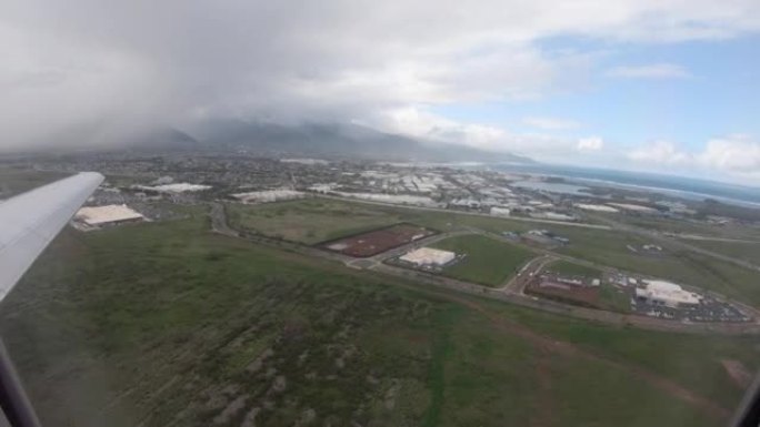 飞机窗外的时间流逝。飞机在夏威夷毛伊岛国际机场征税和起飞。