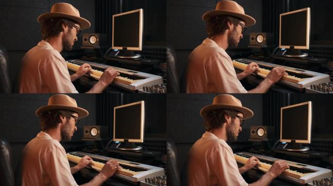 年轻时尚的音乐制作人在midi钢琴上演奏，在现代录音工作室制作新专辑