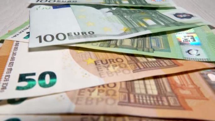 手工点钞欧元。兑现50欧元钞票。面值50欧元的钞票。现金背景为欧元。欧洲的纸币政策与此无关。外币的财