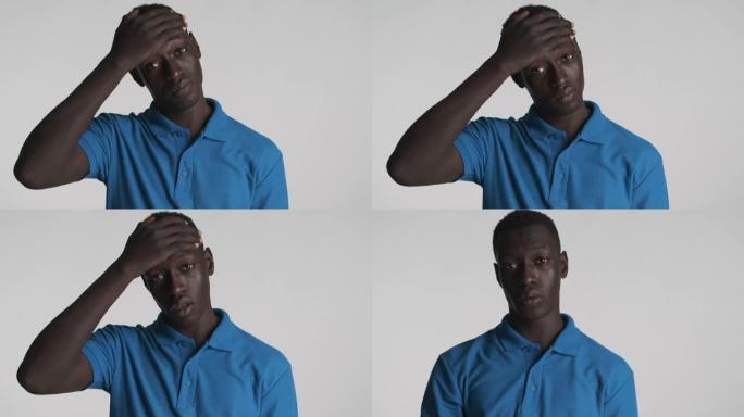 年轻的非洲裔美国男子的肖像疲倦地遮住脸，挥舞着no
