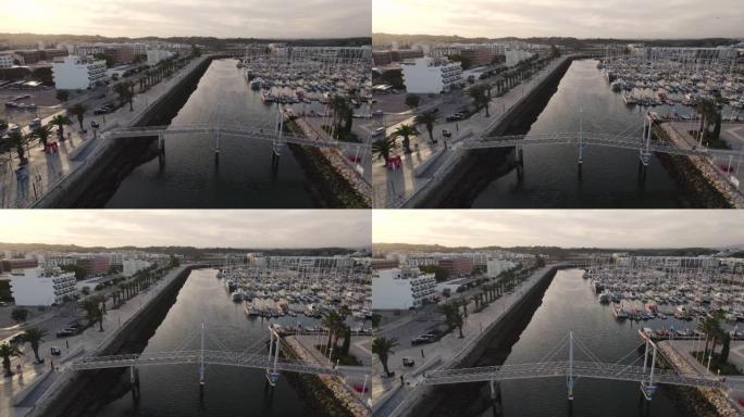 葡萄牙滨海拉各斯阿尔加维的吊桥和船坞的布罗尔电影鸟瞰图。