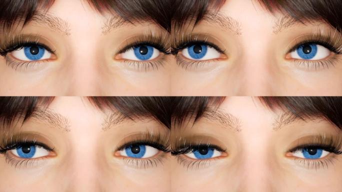 一个蓝色大眼睛的女孩看着镜头特写。蓝眼睛的宏观镜头。这个女孩是用计算机图形制作的。美丽的人类眼睛的特