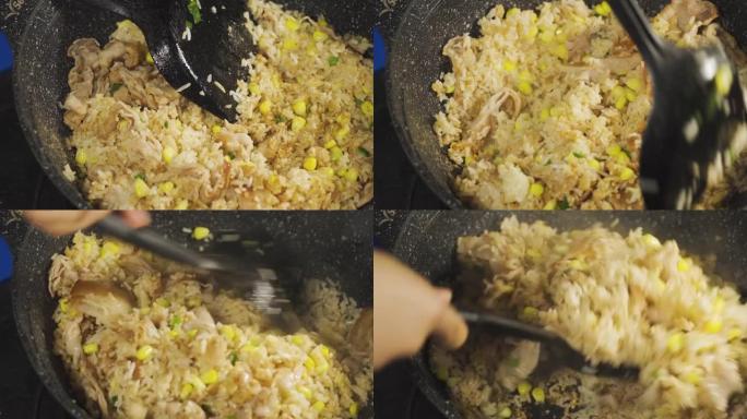 有人在米饭上调味。准备用培根，玉米和大葱做炒饭。泰国菜著名菜单。