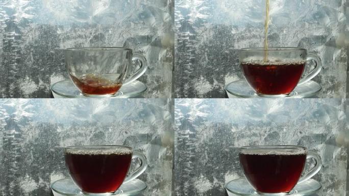 一杯热茶在磨砂的窗户上