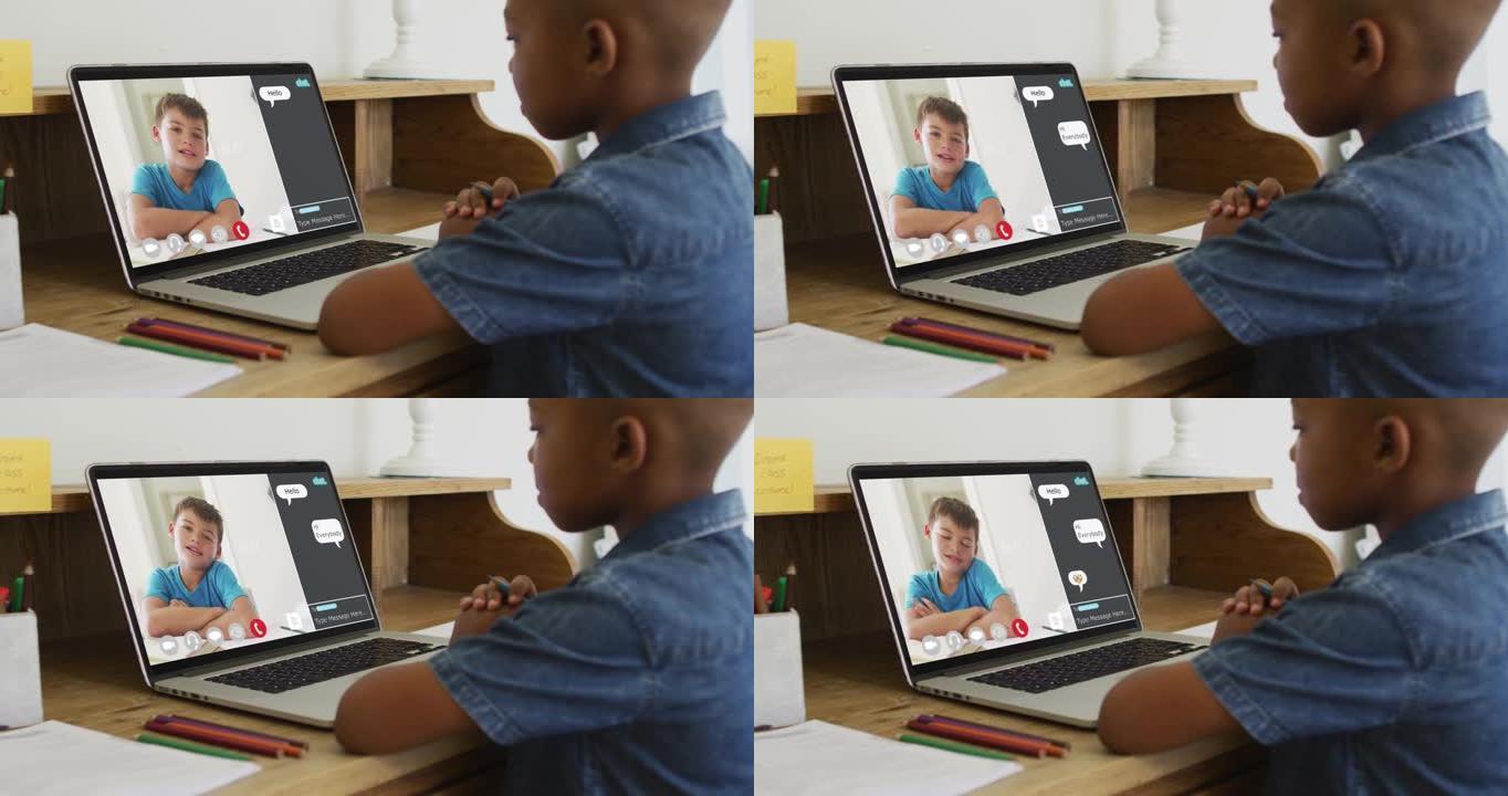 非裔美国男孩拿着一支铅笔在家里的笔记本电脑上进行视频通话