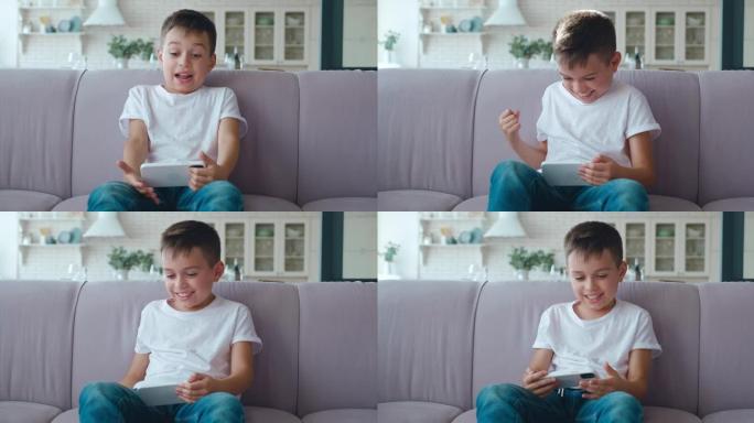 英俊兴奋的男生的4k视频肖像积极地在智能手机上玩电脑游戏，并在获胜时用拳头打手势。