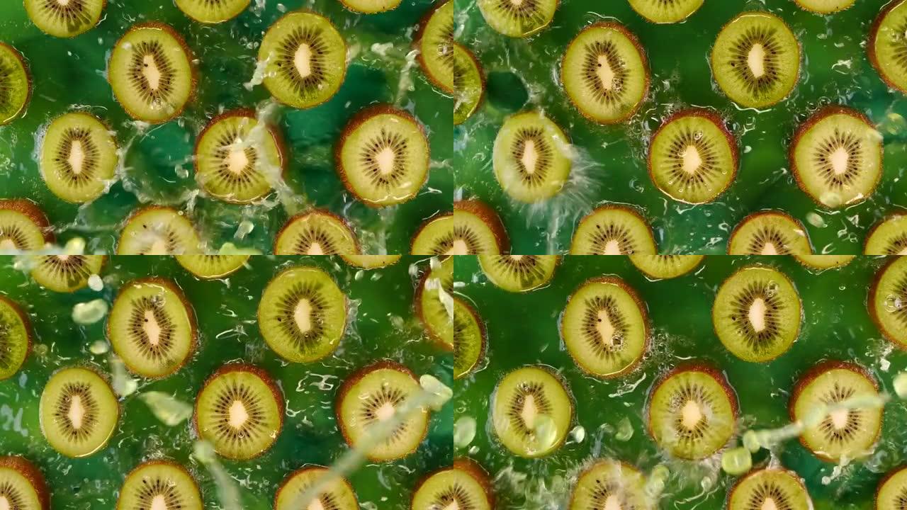 用水或猕猴桃汁在慢动作中溅起的猕猴桃切片。美味的绿色夏季水果。