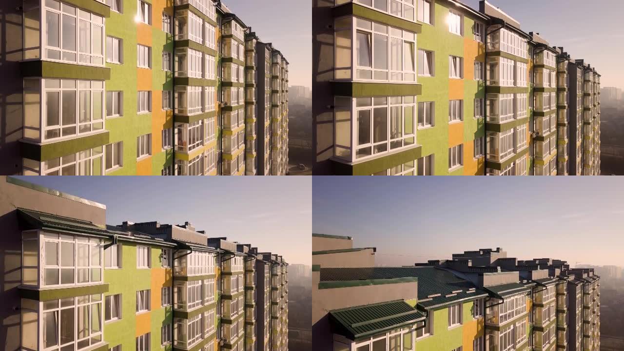 一栋高楼公寓楼的航拍画面，带有许多窗户和阳台。