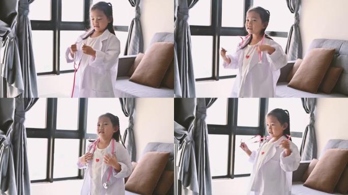 可爱的亚洲小女孩在家穿医服扮演医生