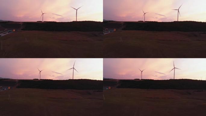 鸟瞰图五台风力涡轮机站在绿色的田野中，拥有美丽的天空背景全景。复制粘贴可再生能源概念背景