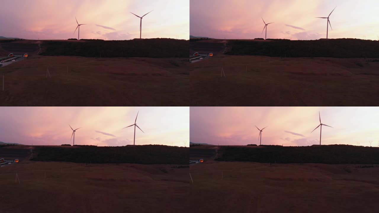 鸟瞰图五台风力涡轮机站在绿色的田野中，拥有美丽的天空背景全景。复制粘贴可再生能源概念背景
