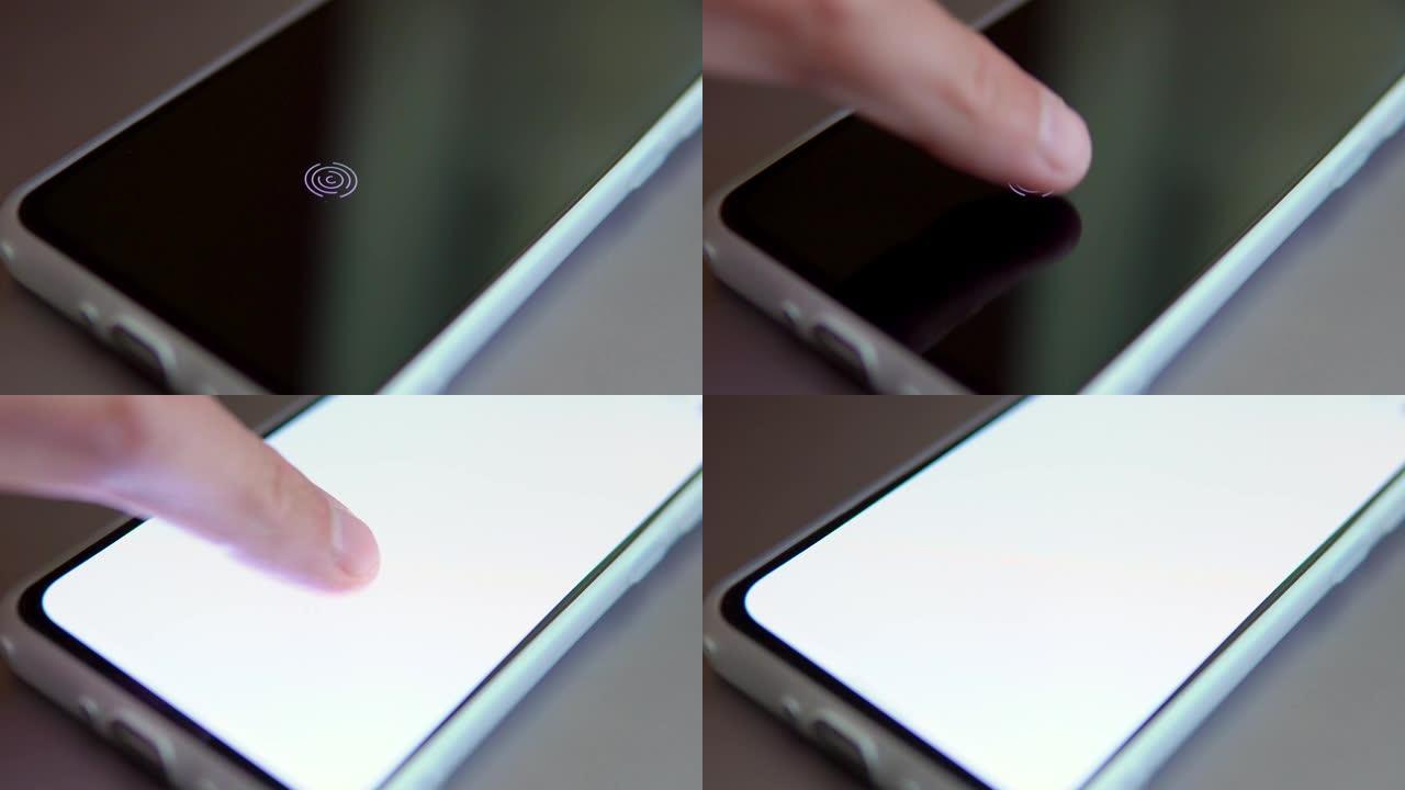 手机屏幕上的指纹扫描仪。触摸屏智能手机，带有触摸人类手指的区域，以解锁设备