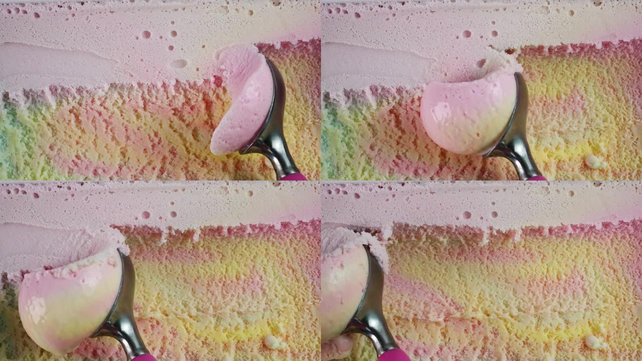 双手舀彩虹五颜六色的冰淇淋。