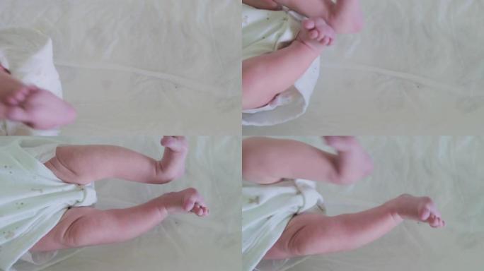 一名新生婴儿在绞痛期间因腹痛而抽搐双腿
