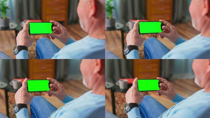 家里的老人在沙发上休息，使用水平横向纵向模式下的绿色模拟屏幕智能手机。女人使用平板电脑设备，浏览互联