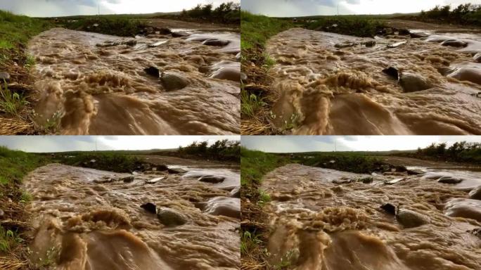 河水急流搅动沉积物，使水变成棕色