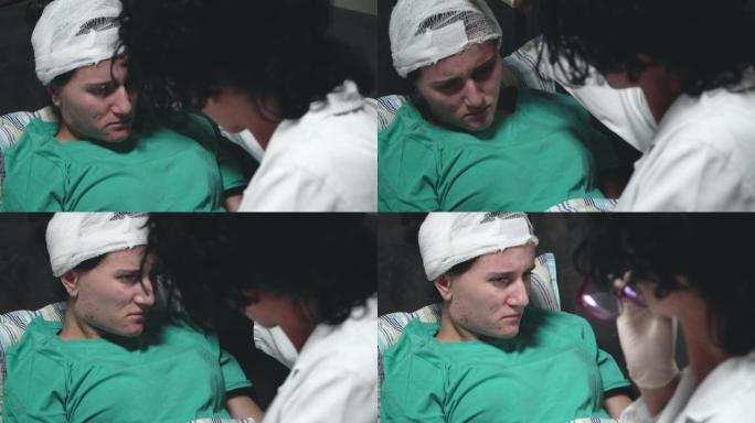 尼斯愉快的医生抱着女孩受伤的头部在医院