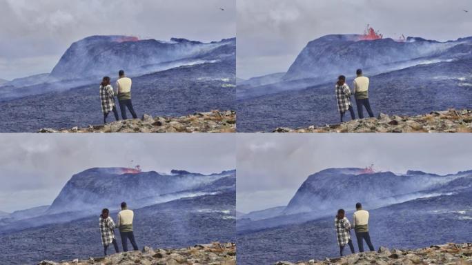 旅行者站在岩石田和火山爆发的景观上