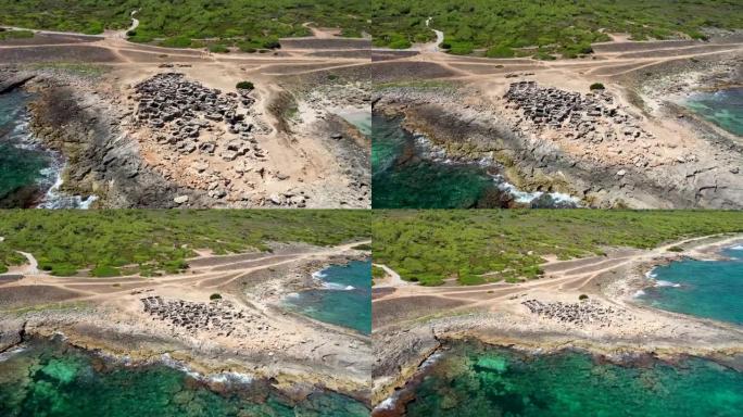 西班牙马略卡岛的空中无人机画面显示了史前墓地和考古遗址的历史可以追溯到公元前7世纪，有100多个坟墓