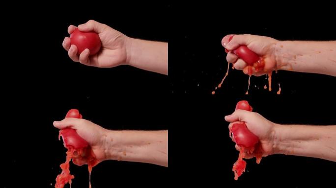 雄性手压碎新鲜的红番茄，并将健康蔬菜中的所有种子汁和果肉暴露。在工作室孤立的黑色背景上从番茄中榨汁。