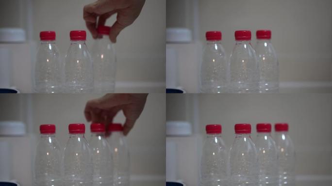 厨房桌子上的塑料瓶。水瓶回收塑料