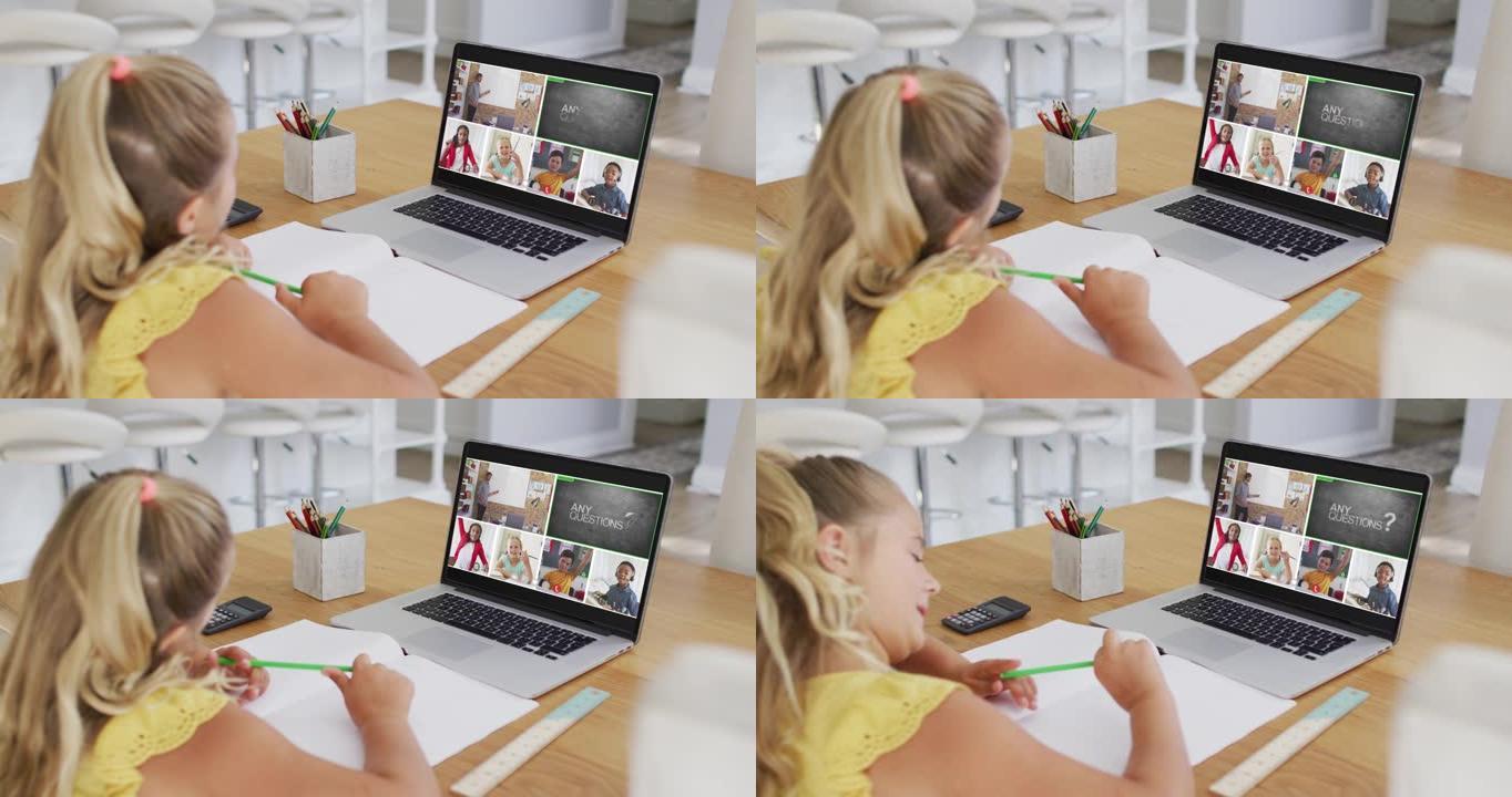 白人女孩在家里用笔记本电脑进行视频会议时做作业