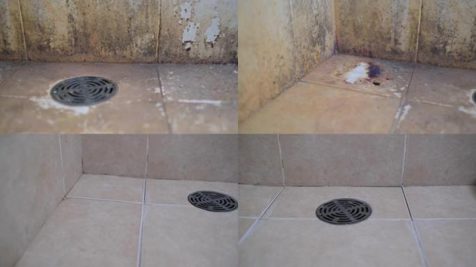 不干净的浴室地板污渍，有地衣和脏污渍，清洗后瓷砖接缝上仍然有一些痕迹