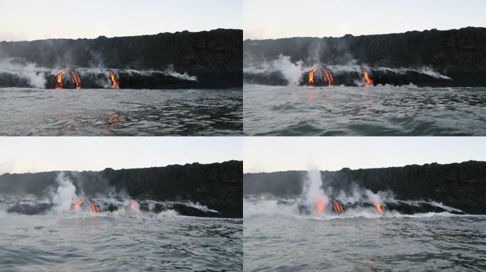 熔岩海洋流动的熔岩到达夏威夷大岛的海洋。从美国夏威夷火山国家公园附近的基拉韦厄火山流出的水中看到的熔