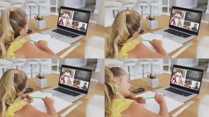 白人女孩在家里用笔记本电脑进行视频会议时做作业