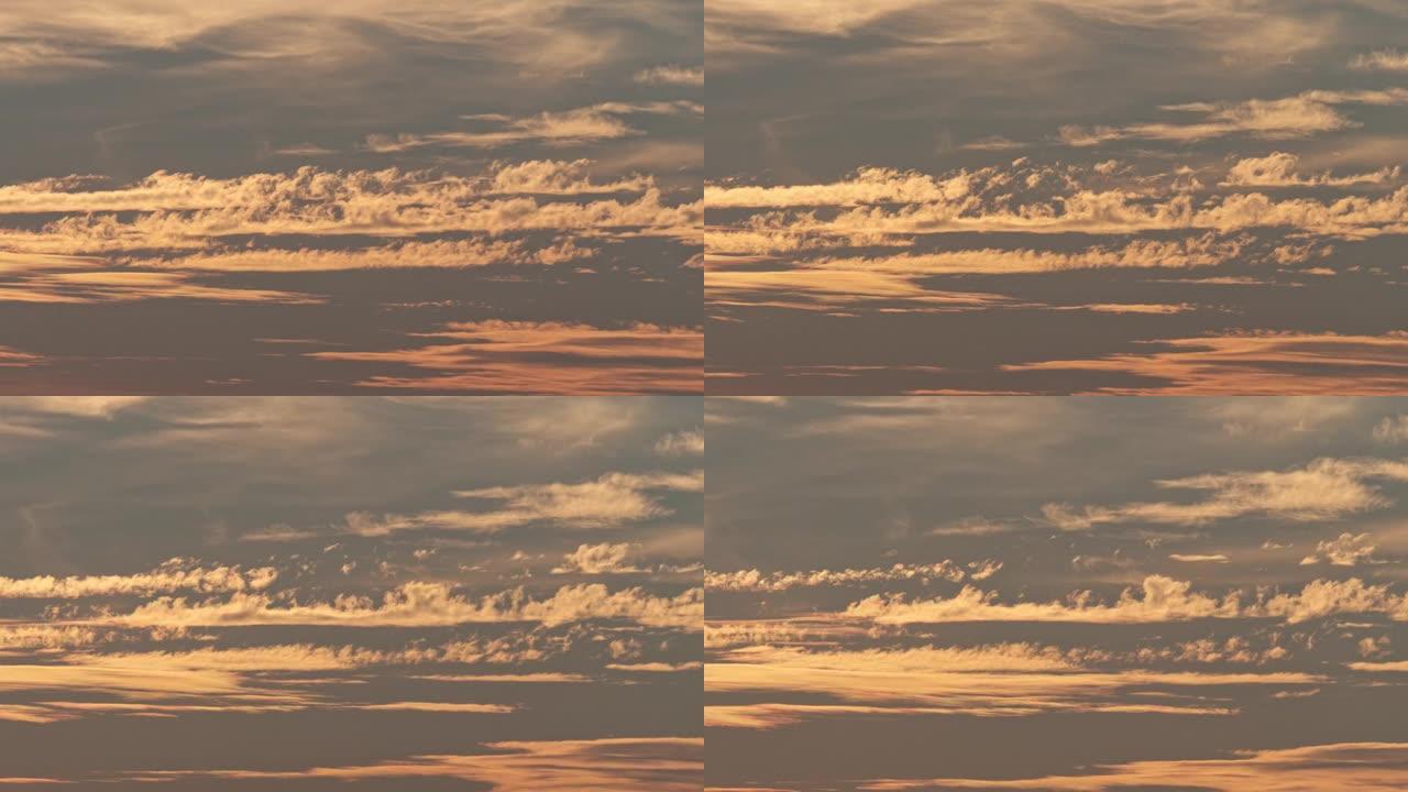 在日落时间用光线关闭云层自然背景延时镜头，红色橙色蓝色日落天空云4k放大效果。