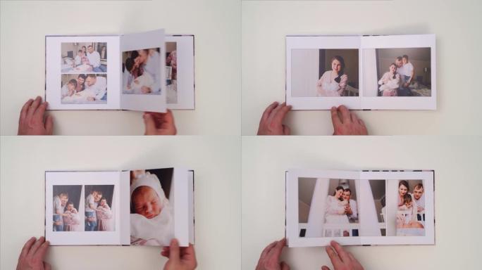 在白色背景上，双手翻阅家庭家庭照片拍摄的相册