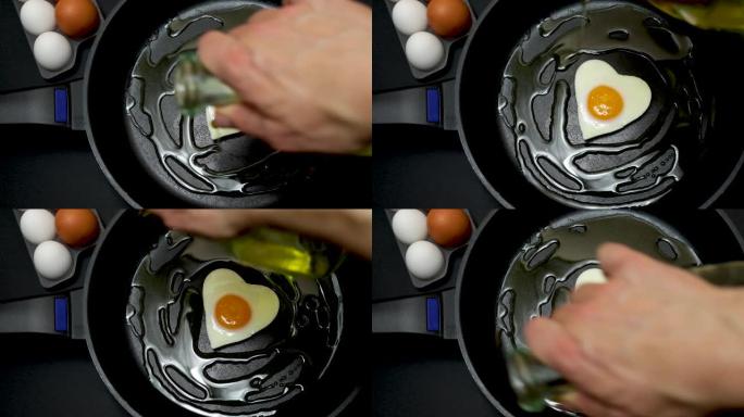 一个煎锅，里面有一个心形的煎蛋，旁边是六个白色和棕色的鸡蛋，全部在黑色背景上，健康的烹饪和胆固醇概念