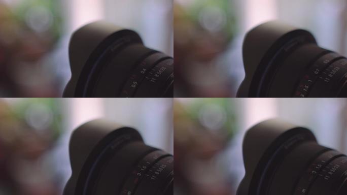 在摄影过程中，用手转动镜头上的光圈环，特写镜头。