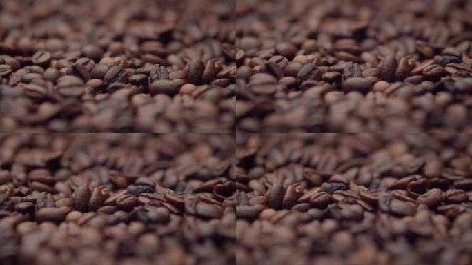 一堆咖啡豆躺着，特写。一堆烤香咖啡种子。能量和活力的概念