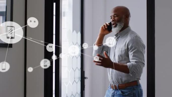 反对非裔美国高级商人在办公室用智能手机聊天的数字图标网络
